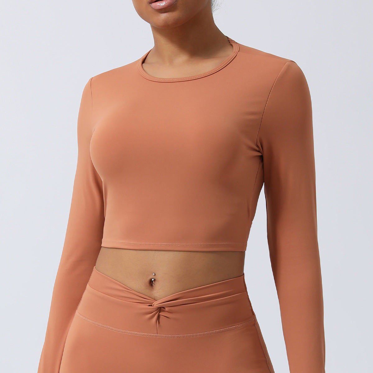 Spring New nude hollow-out beauty back sports top twisted short yoga clothes with chest pad long sleeve T-shirt workout clothes