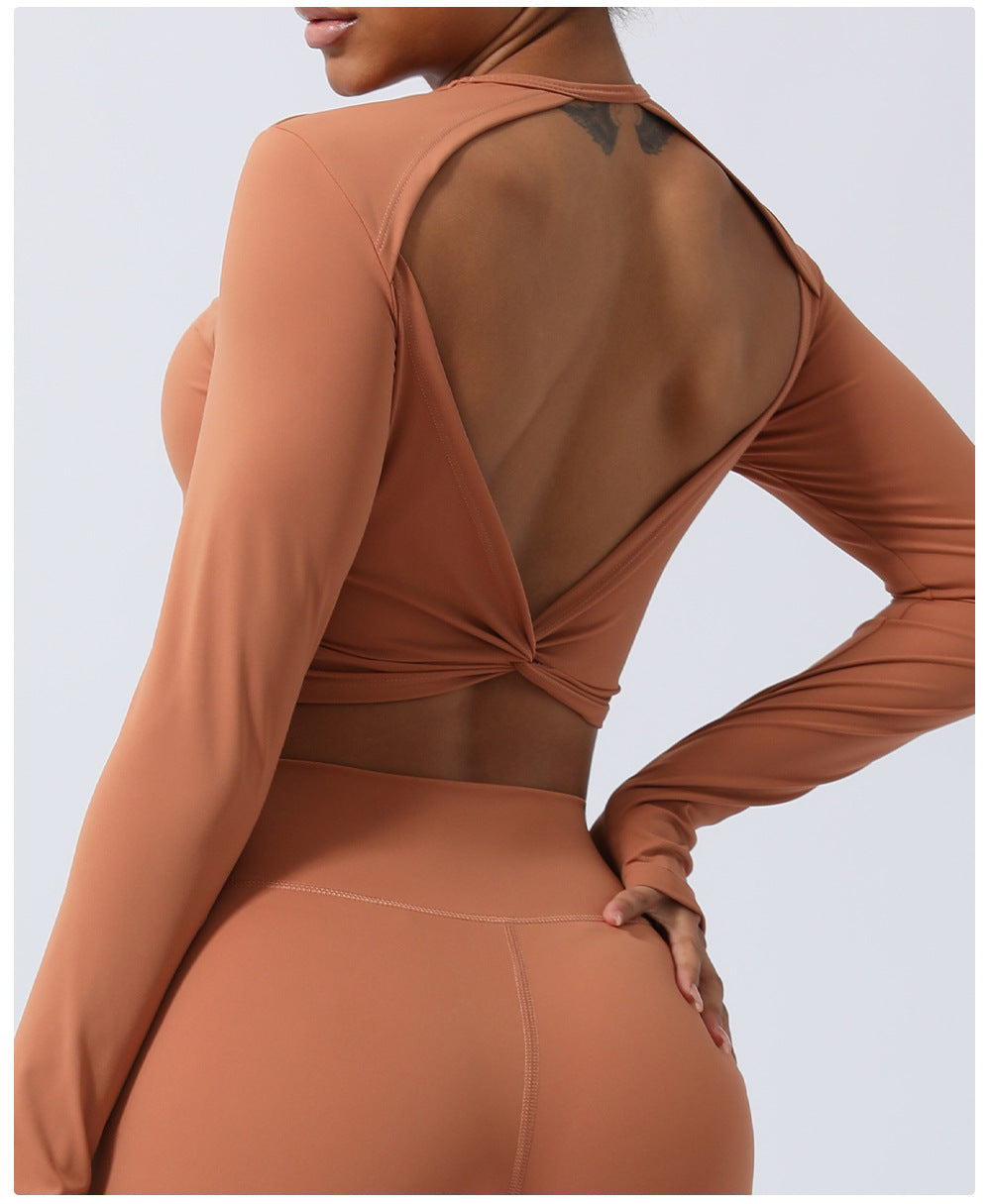 Spring New nude hollow-out beauty back sports top twisted short yoga clothes with chest pad long sleeve T-shirt workout clothes
