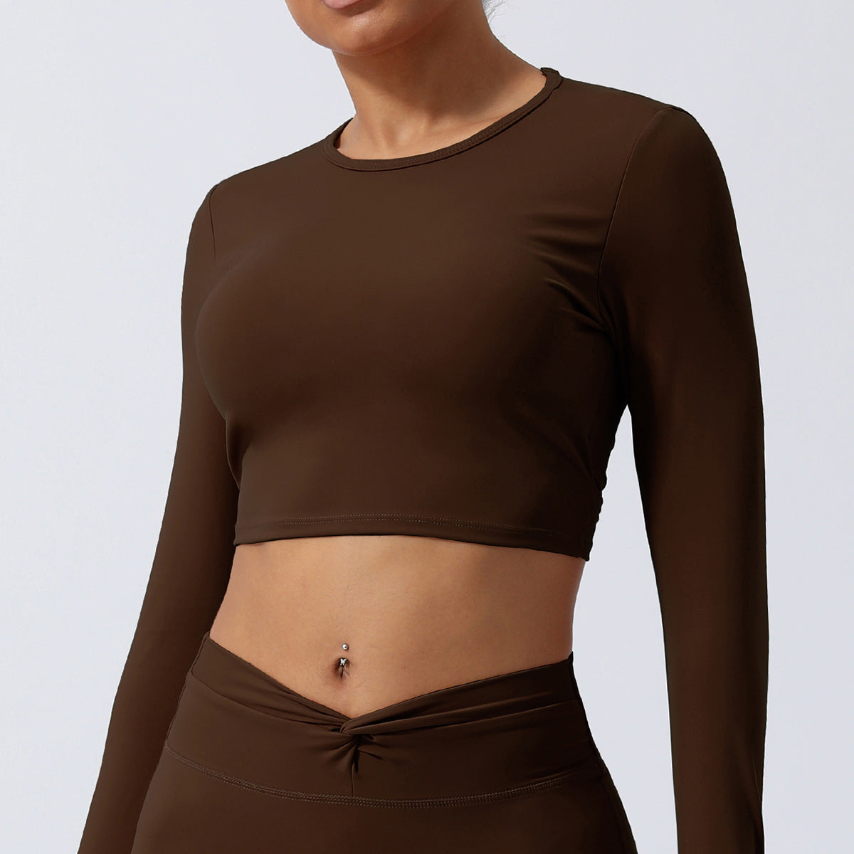 Spring New nude hollow-out beauty back sports top twisted short yoga clothes with chest pad long sleeve T-shirt workout clothes